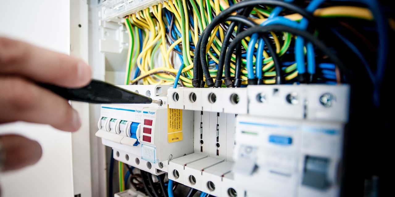 electrician working on power board