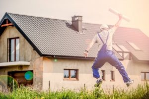 Factory worker leaping for joy