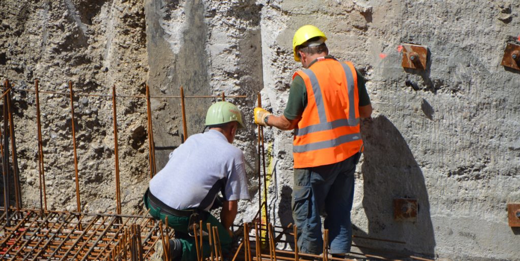 two construction workers training