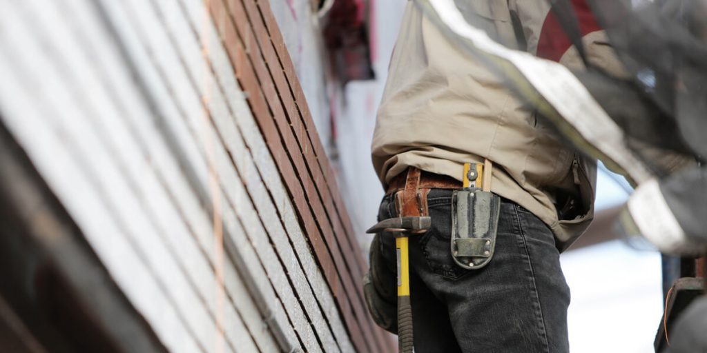 mason worker laying brick