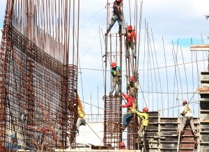 constructions workers adding steel framing