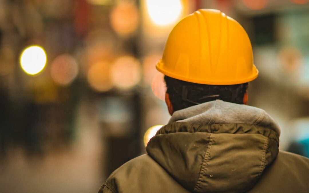 younger worker wearing a yellow hard hat